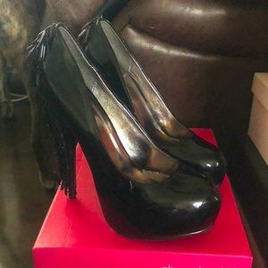 Black hells with tassels on heels